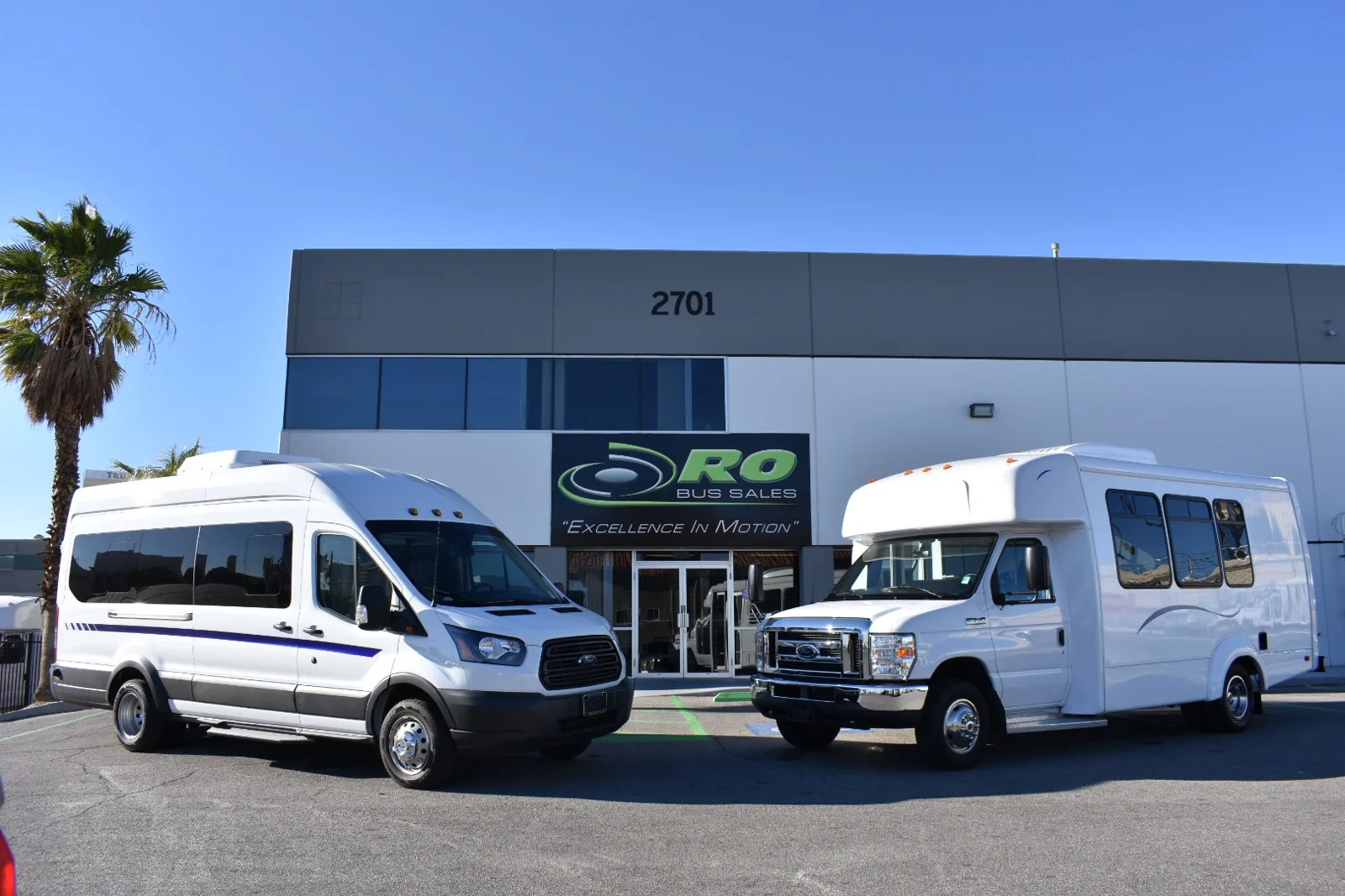 Ford Transit vs E Series shuttle comparison with RO Bus commercial vehicles parked side by side